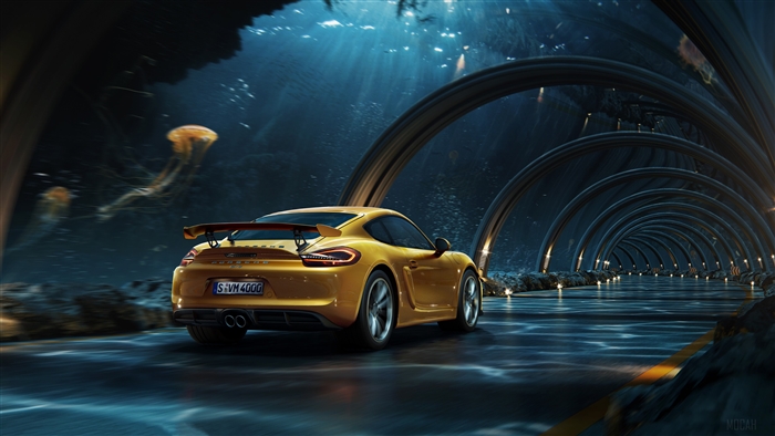 Yellow Porsche driving through underwater tunnel with jellyfish