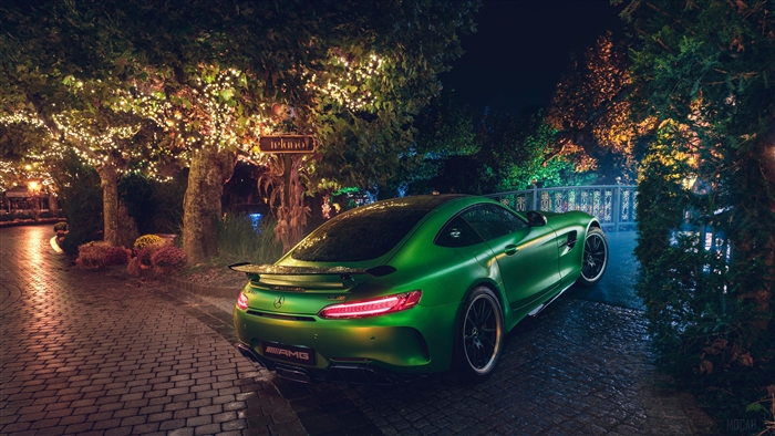 Green Mercedes AMG GT R parked at night