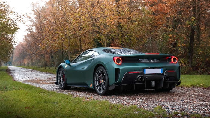 Green Ferrari 488 Pista on a dirt road