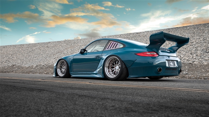 Teal Porsche 911 Turbo with large rear wing