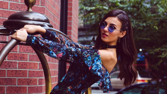 Victoria Justice in floral dress with sunglasses
