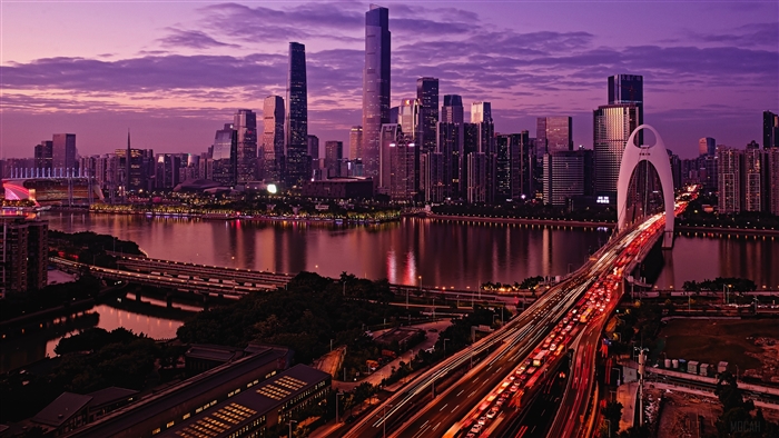 Guangzhou cityscape with bridge and river at dusk 4K