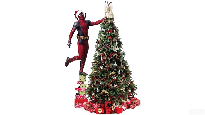 Deadpool decorating a Christmas tree