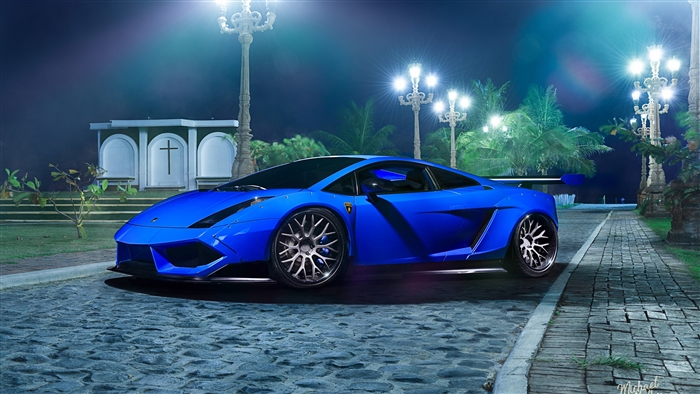 Blue Lamborghini Gallardo on cobblestone street at night