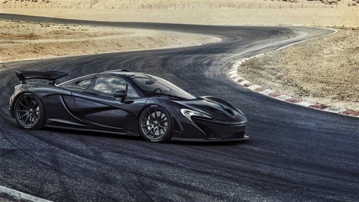 Black McLaren P1 XP7 on a race track