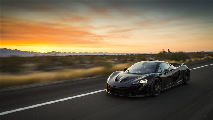 Black McLaren P1 XP7 driving on road at sunset 4K