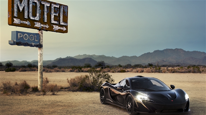 Black McLaren P1 XP7 in desert with motel sign
