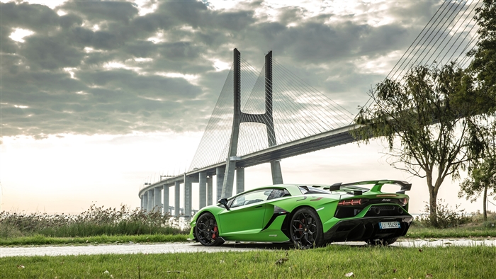 Green Lamborghini Aventador SVJ 2019 near Vasco da Gama Bridge