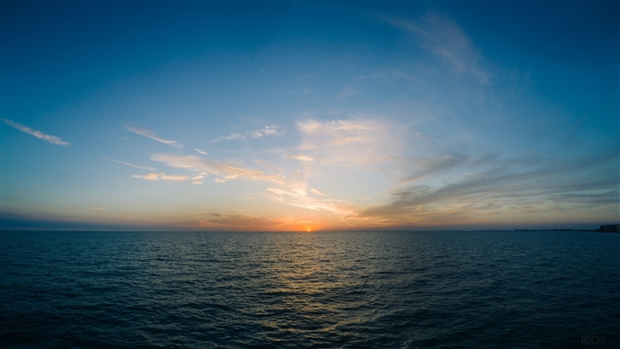 Sunset over the sea with clouds 4K
