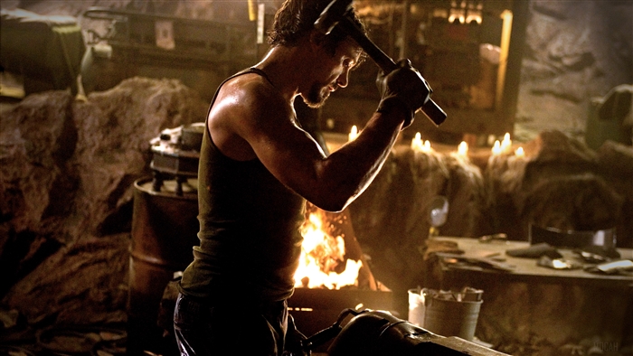 Tony Stark forging armor in a cave 4K