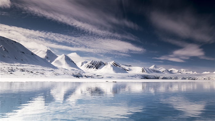 Snowy mountains reflected in calm water, Svalbard 4K