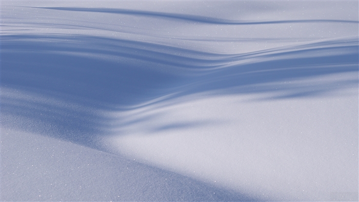Minimalist snow dunes with shadows in winter 4K
