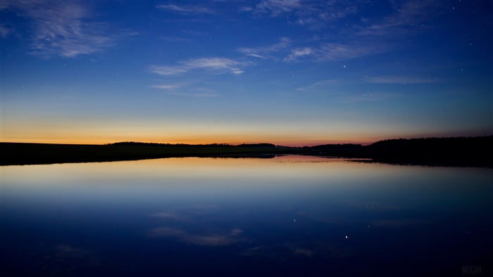 River at dusk with stars and clouds