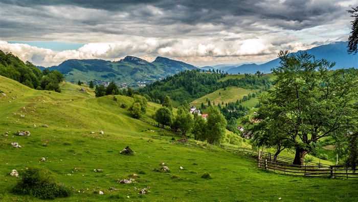 Rolling green hills and mountains in Romania 4K