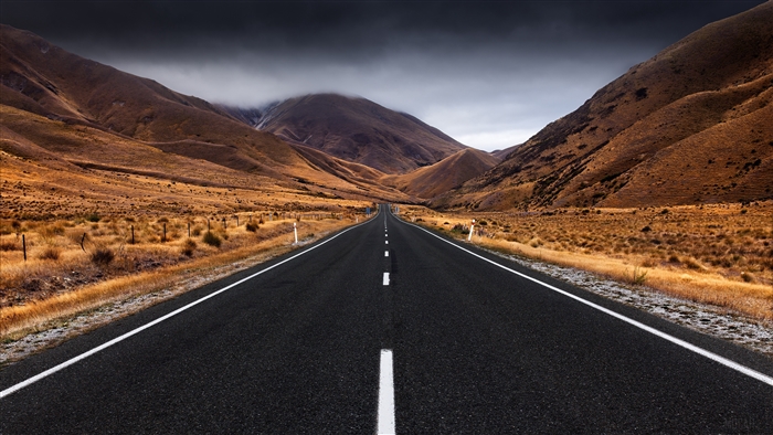 Empty Road Through Mountain Valley