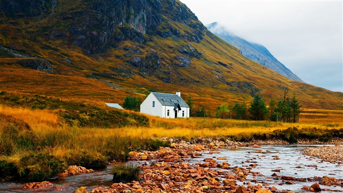 White house in mountains with river and stones 4K