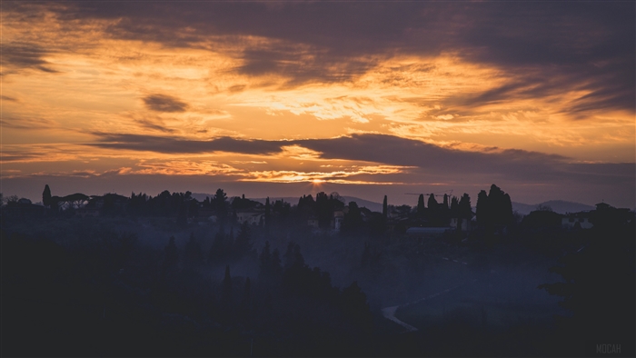Florence, Italy at dawn with fog and dramatic sky