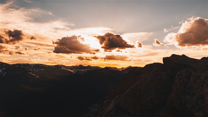 Sunset over mountains with clouds 4K