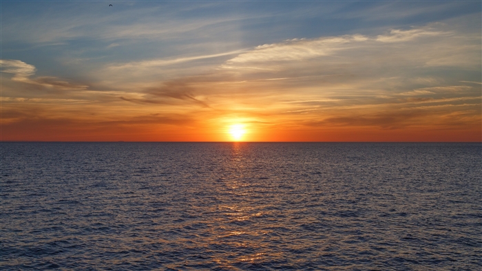 Sunset over the sea with clouds 4K