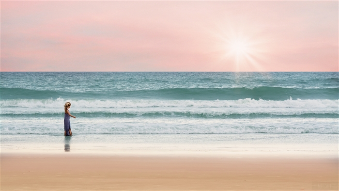 Girl walking in the ocean at sunset, pastel sky 4K