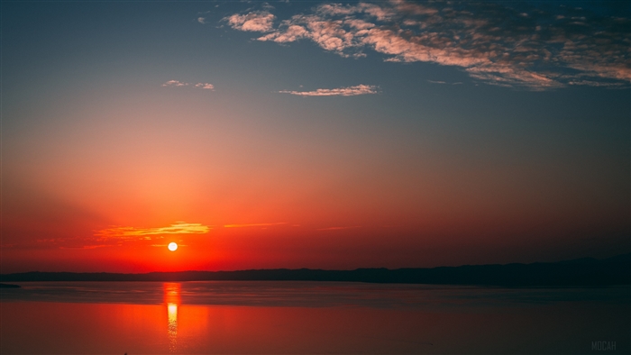 Sunset over the sea with clouds