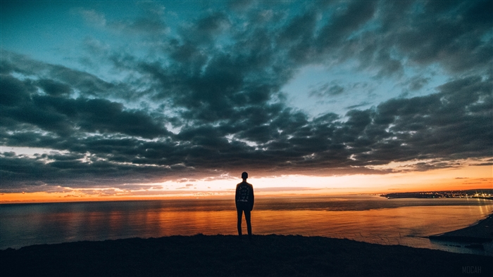Boy Watching Sunset Over Calm Sea 4K