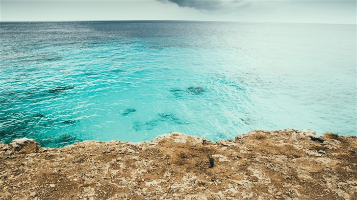 Ocean cliff overlooking turquoise water