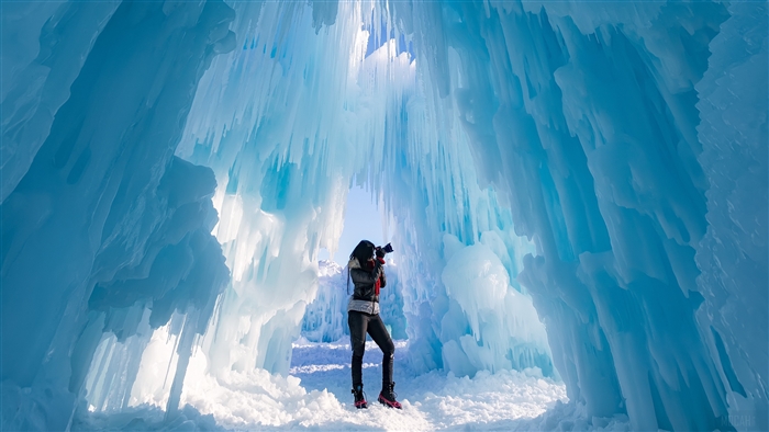 Photographer in an ice castle