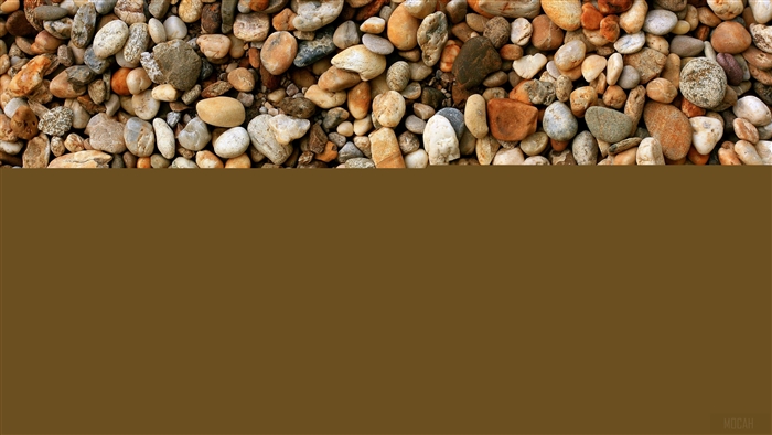 Pebbles and stones on a brown background