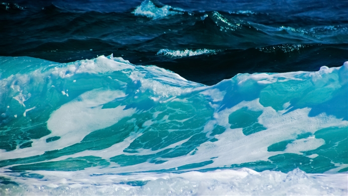 Turquoise ocean waves with white foam