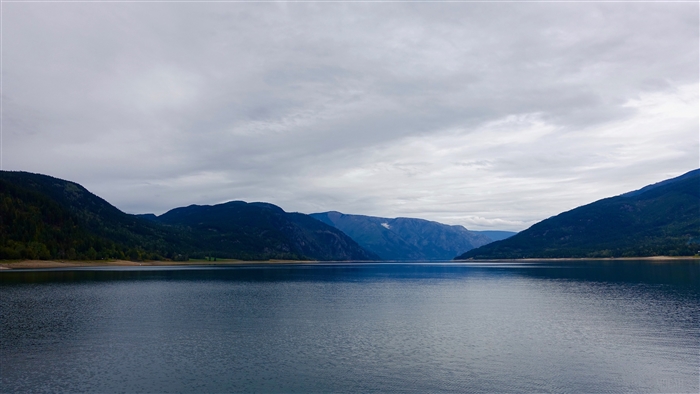 Mountains and Lake under Cloudy Sky 4K
