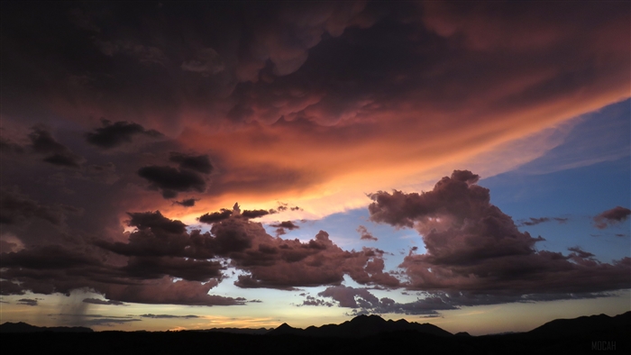 Sunset clouds over mountains 4K