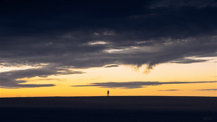 Man silhouette against sunset sky