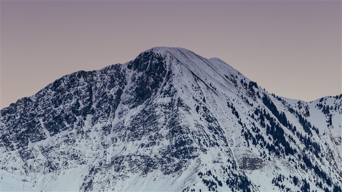 Snowy mountain peak at twilight
