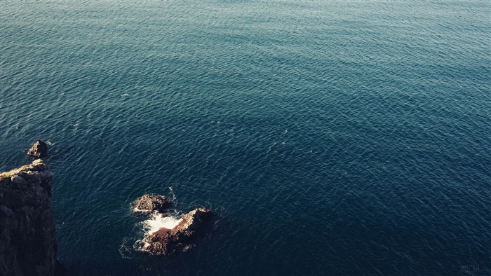 Sea surface with rocks and waves 4K