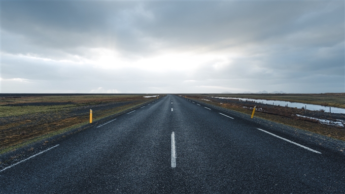 Empty Road Towards Horizon Under Cloudy Sky 4K