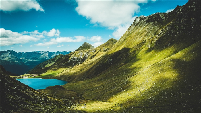 Mountain landscape with lake and green hills