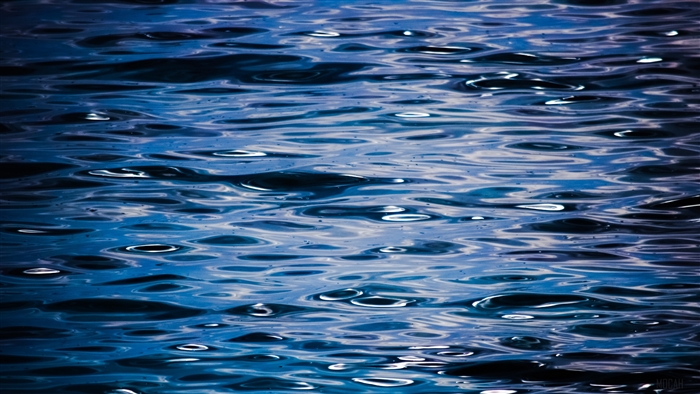 Blue water ripples with light reflections 4K