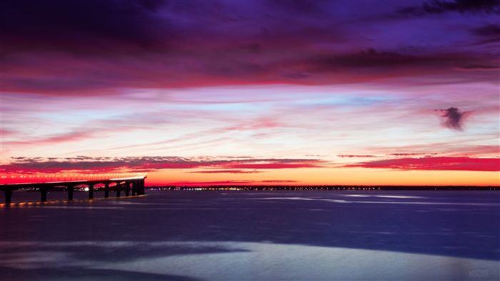 Bridge over water at sunset 4K