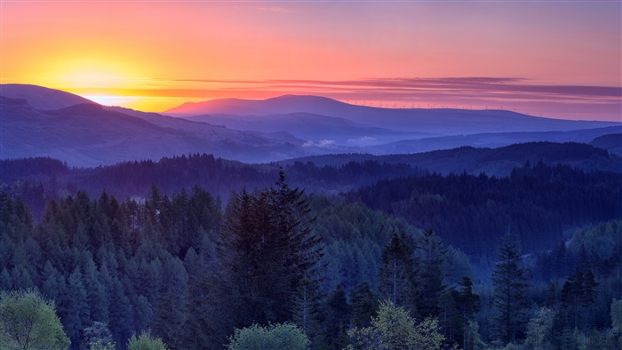 Sunset over mountains and forest in Scotland 4K