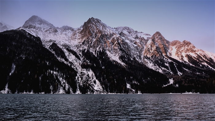 Snow-capped mountains over a lake