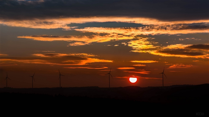 Windmills at sunset with dramatic clouds 4K