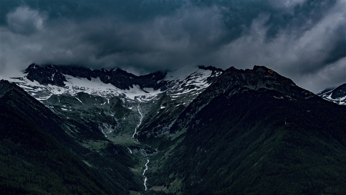 Dark Clouds Over Snowy Italian Alps