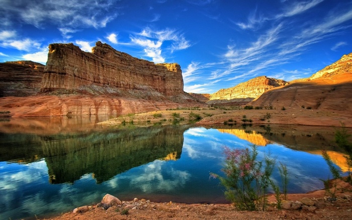 Desert canyon with a lake and rock formations