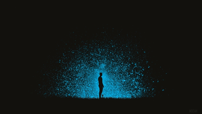 Silhouette of a man with blue particles exploding