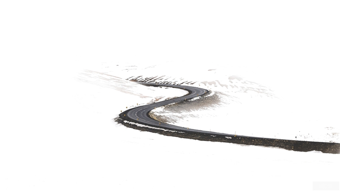 Winding Road Through Snowy Landscape 4K