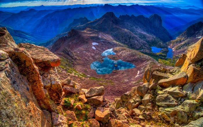 Mountain landscape with alpine lakes and rocky foreground