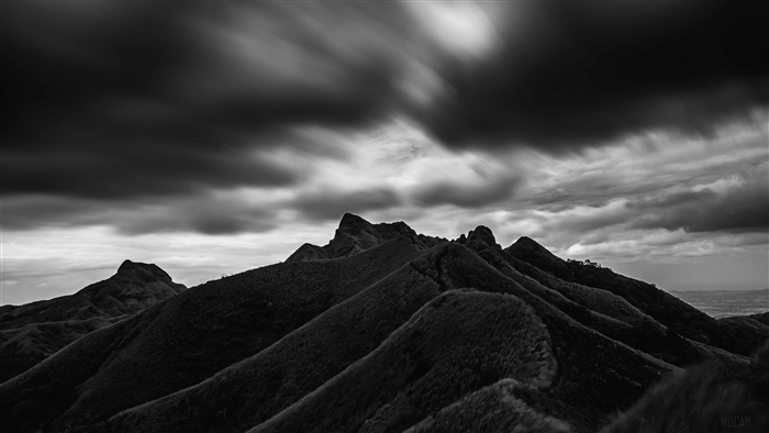 Black and White Mountain Range with Dramatic Clouds