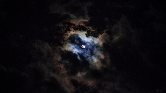 Moon behind clouds at night 4K