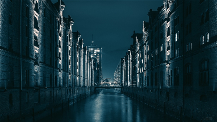 Hamburg Germany canal at night with warehouses and bridge 4K